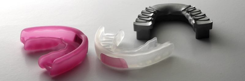 Silicone prototypes of an athletic mouth guard.